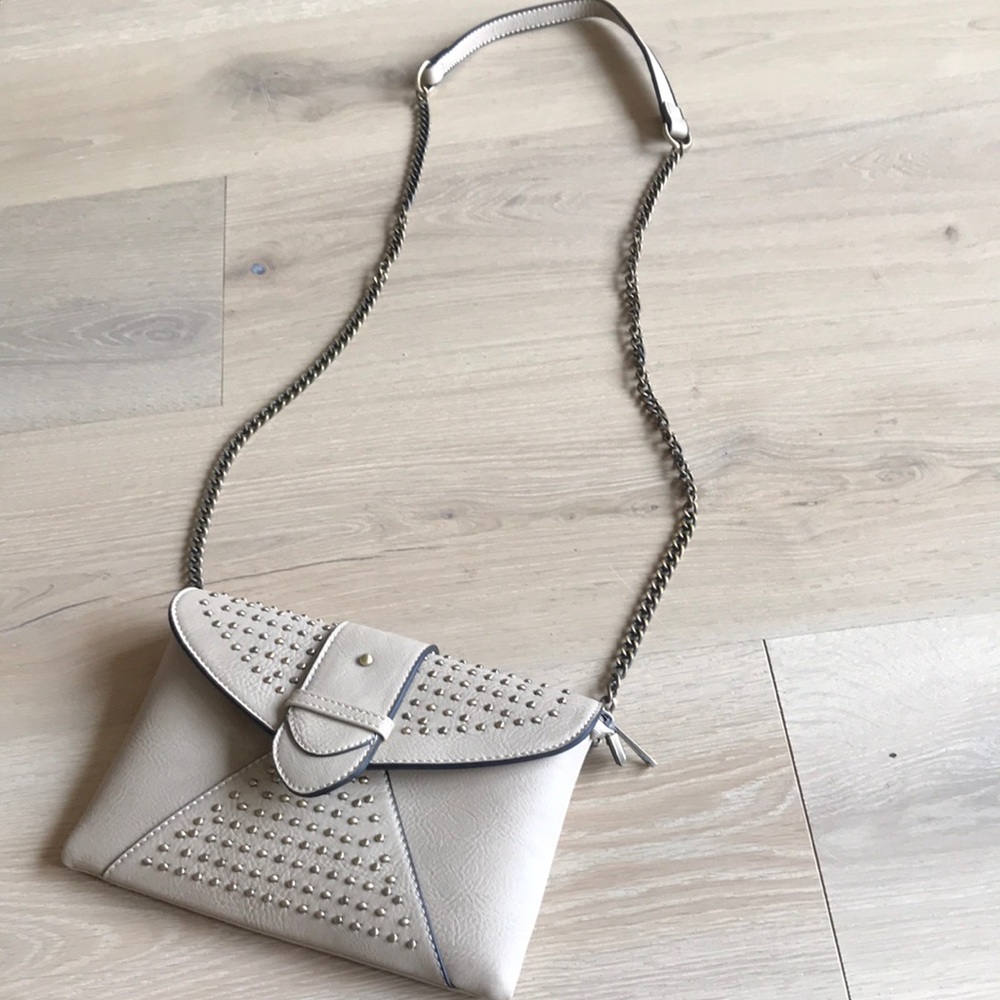 Boutique faux leather bag with ample pockets and stud pattern.